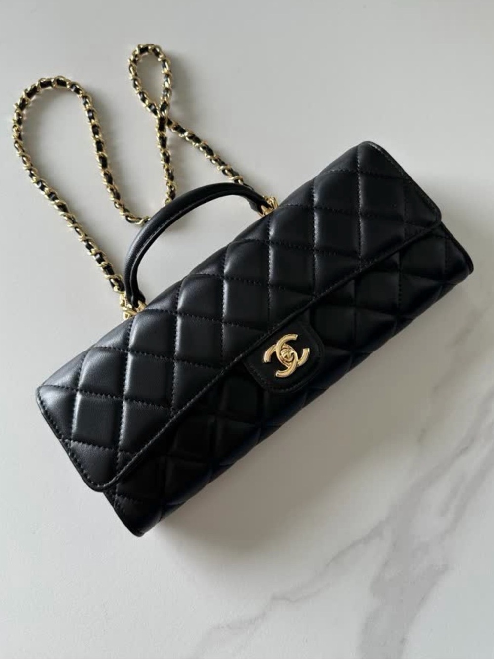 Leather Quilted Top Handle Flap Bag in Black